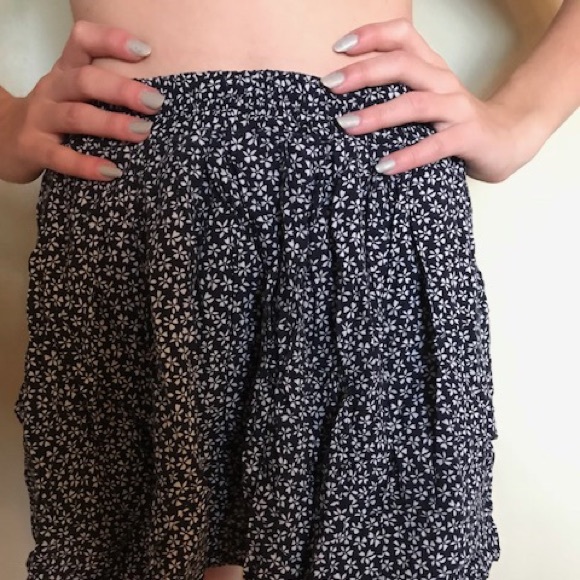 Brandy Melville Dresses & Skirts - Brandy mini black skirt with white flowers